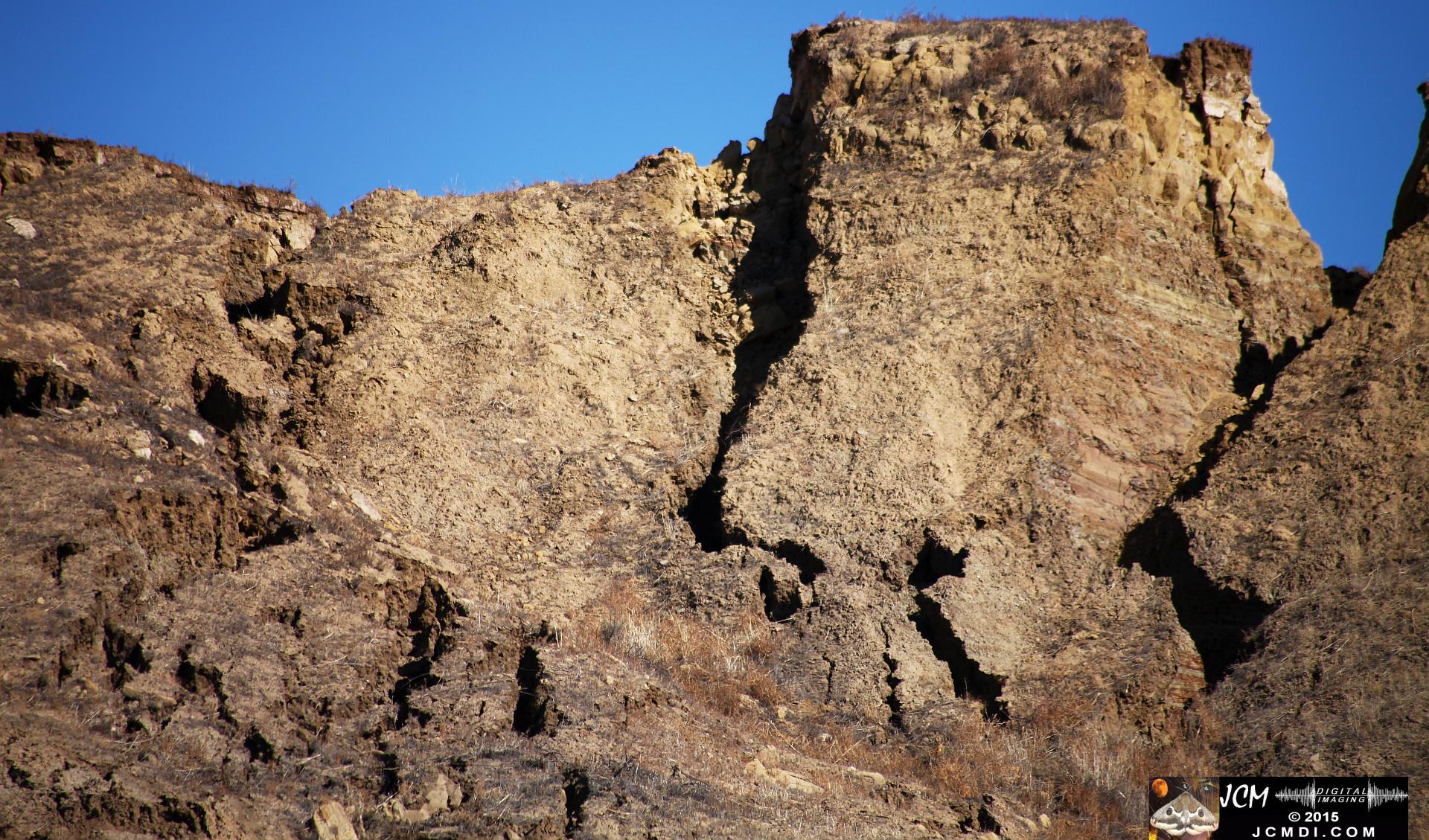 Landslide, buckled pavement, and terrain at Vasquez Canyon Road in Santa Clarita, CA filmed 11-25-2015